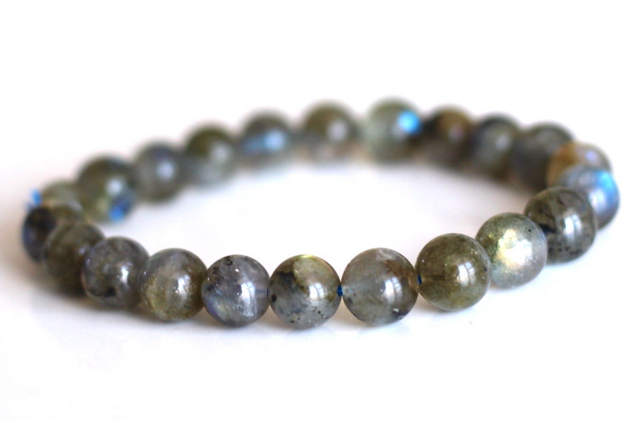 Close-up of labradorite bracelet showing blue green labradorescence