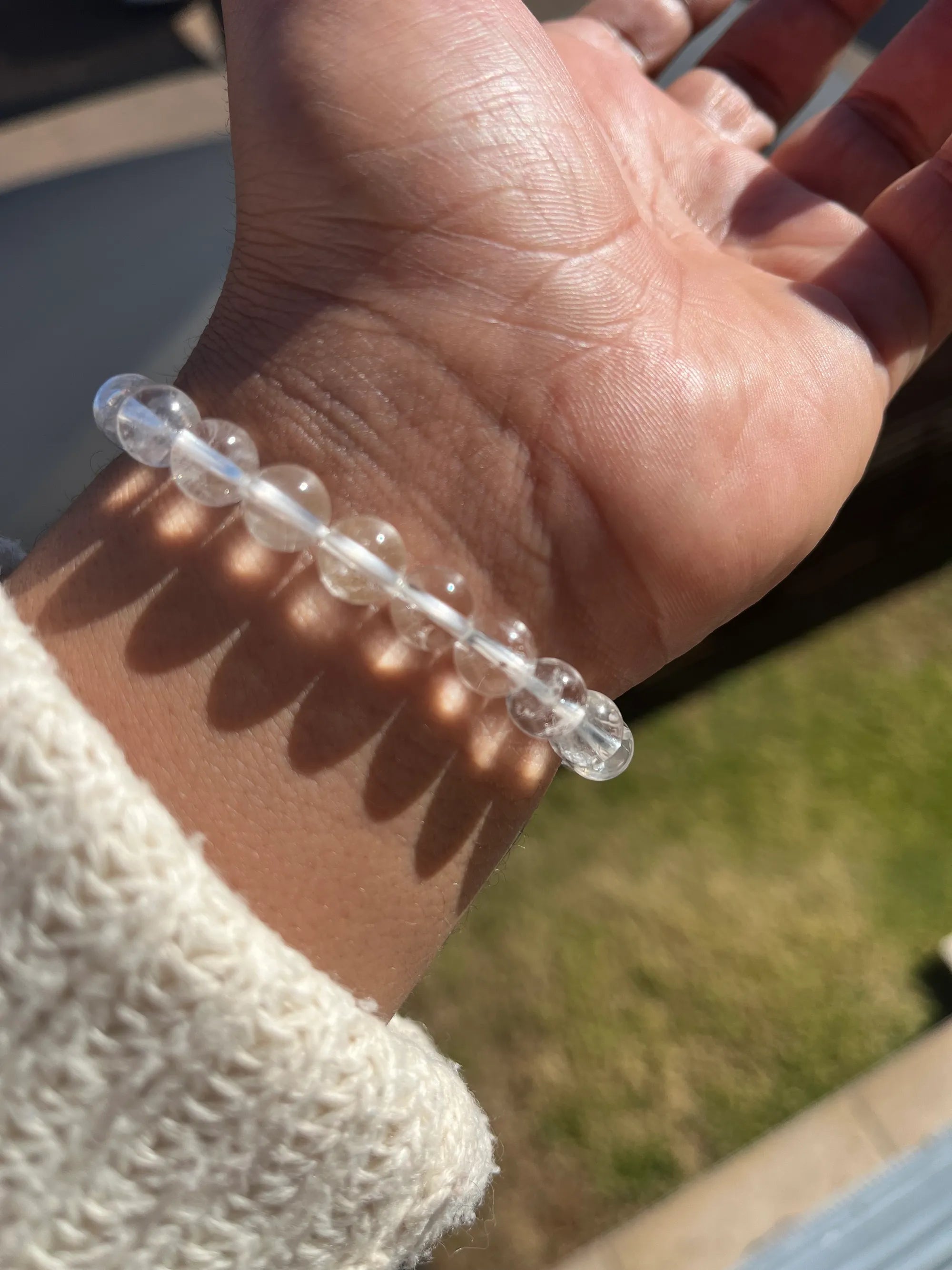 Woman wearing a VIKA bracelet by Ozyn Wellness