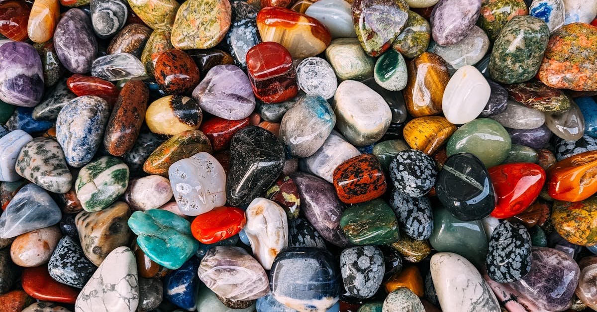 Vibrant assortment of polished gemstones displaying rich colors and textures.