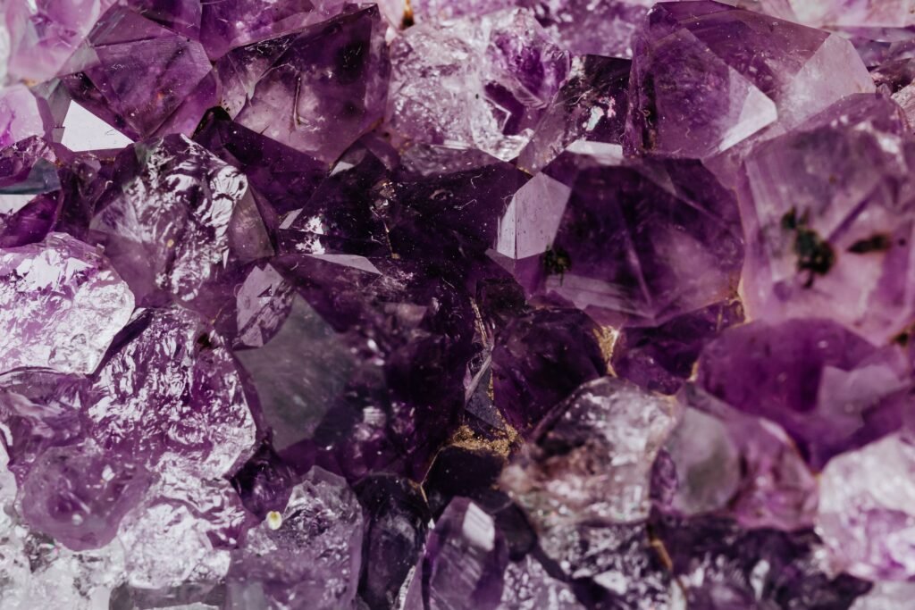 From above of semiprecious purple faceted quartz stones before processing and pasting into jewelry
